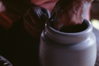 Clay being shaped on a potter's wheel